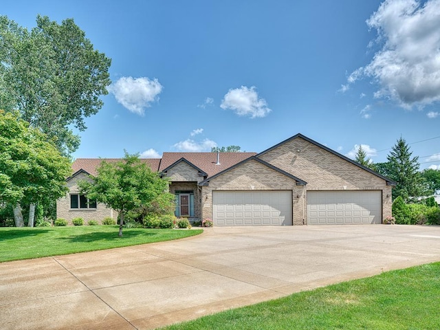 view of front of house with a front lawn and a garage