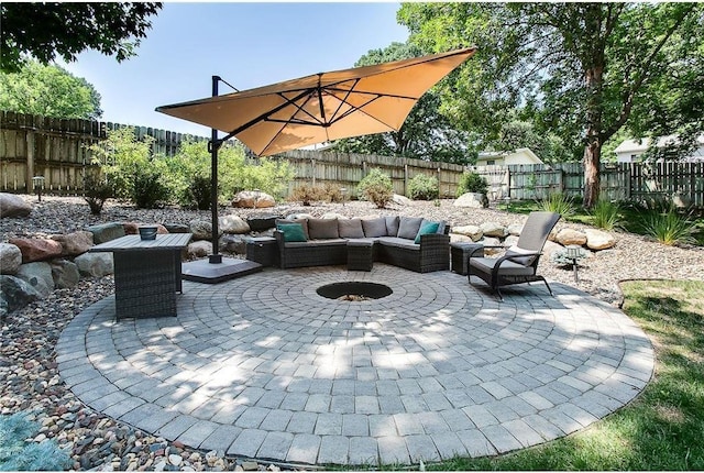 view of patio featuring a fenced backyard and an outdoor living space