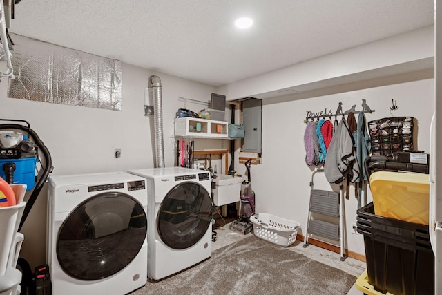 washroom with laundry area, electric panel, independent washer and dryer, and a textured ceiling