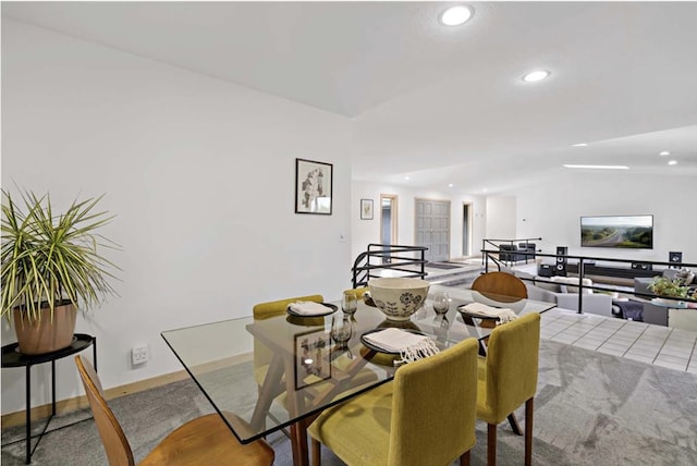 dining room with recessed lighting, baseboards, and lofted ceiling