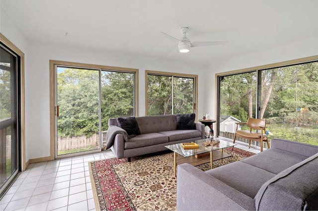 sunroom / solarium featuring a wealth of natural light and a ceiling fan