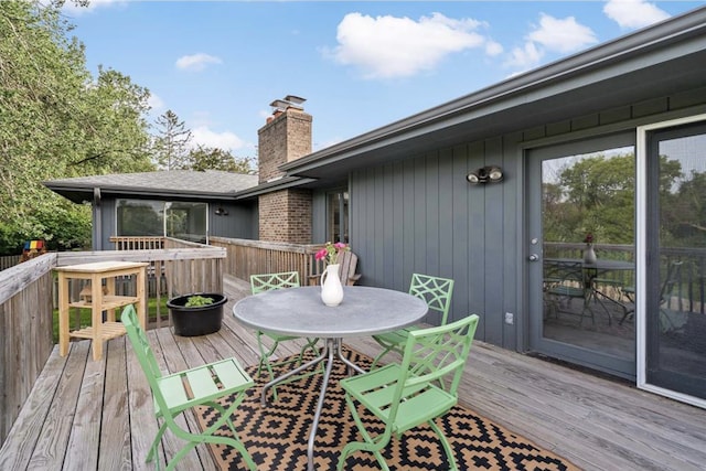 deck featuring outdoor dining area