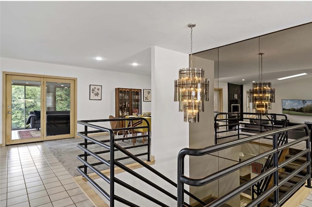 dining area with a chandelier, light tile patterned floors, and recessed lighting