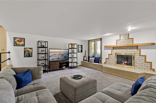 living room featuring a brick fireplace and carpet