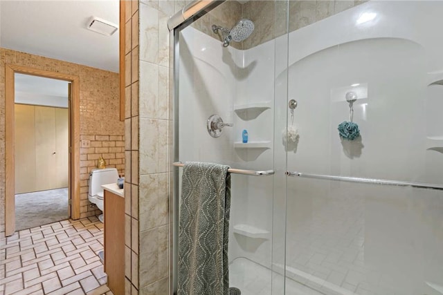 full bathroom with visible vents, a shower stall, toilet, and vanity