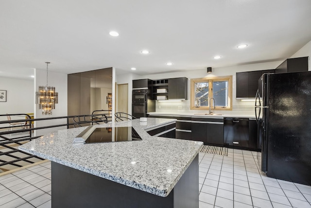 kitchen with light tile patterned flooring, recessed lighting, black appliances, and a sink