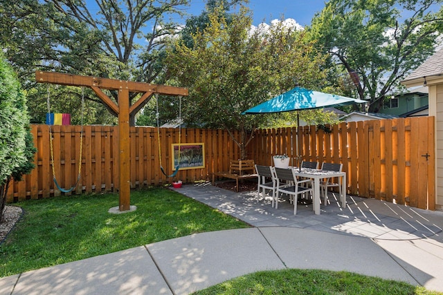 view of patio with a fenced backyard and outdoor dining space