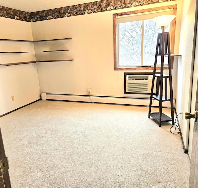 unfurnished room featuring a wall mounted air conditioner and carpet flooring