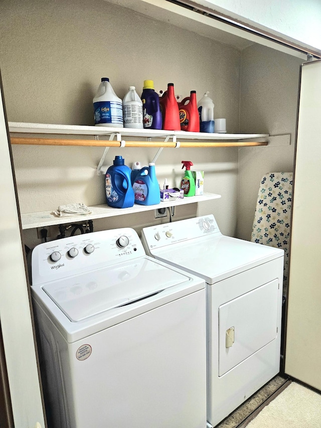 clothes washing area featuring laundry area and washing machine and dryer