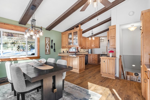 dining room with ceiling fan, dark wood-style flooring, and vaulted ceiling with beams