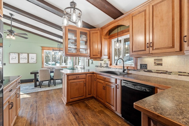 kitchen featuring dark wood finished floors, lofted ceiling with beams, plenty of natural light, a sink, and black appliances