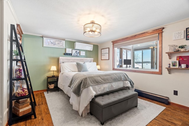 bedroom with baseboards, a notable chandelier, wood finished floors, and a wall unit AC