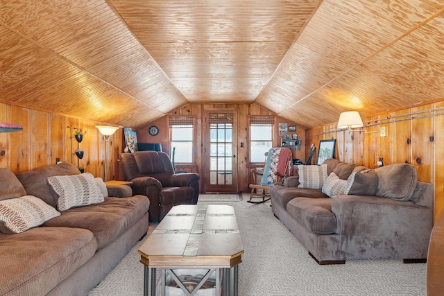 living area with carpet, wooden ceiling, vaulted ceiling, and wood walls