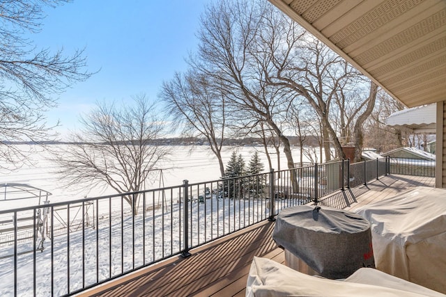 snow covered deck with area for grilling