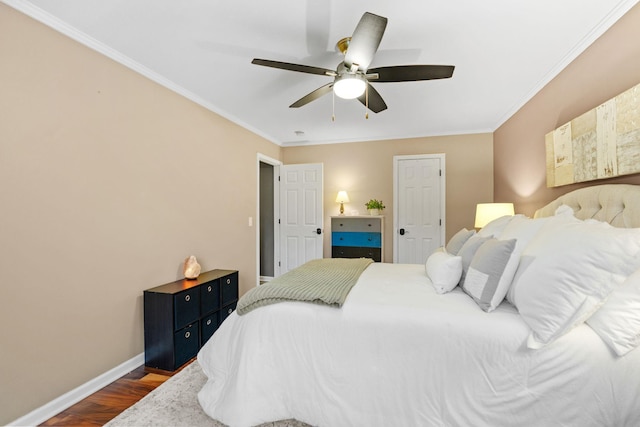 bedroom featuring baseboards, ornamental molding, a ceiling fan, and dark wood-style floors