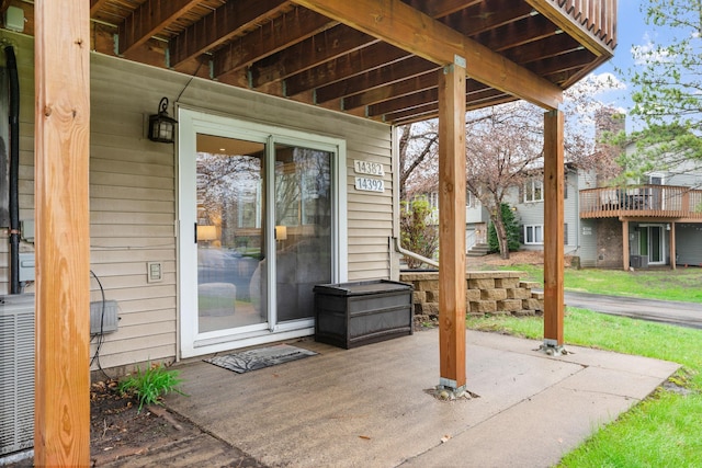 view of patio / terrace featuring central AC and a wooden deck