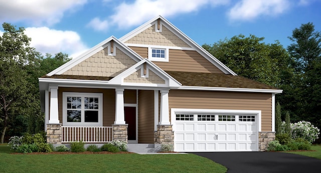 craftsman-style house with covered porch, a garage, and a front lawn