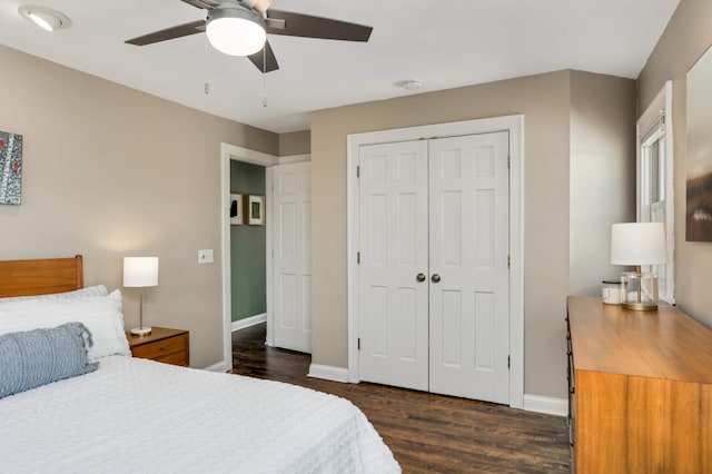 bedroom with a closet, ceiling fan, baseboards, and wood finished floors