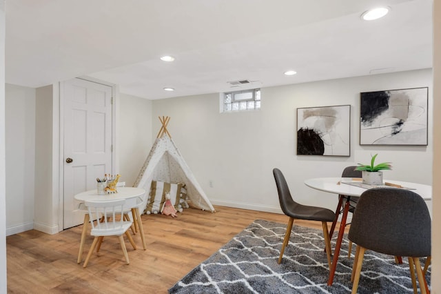 playroom featuring recessed lighting, visible vents, baseboards, and wood finished floors