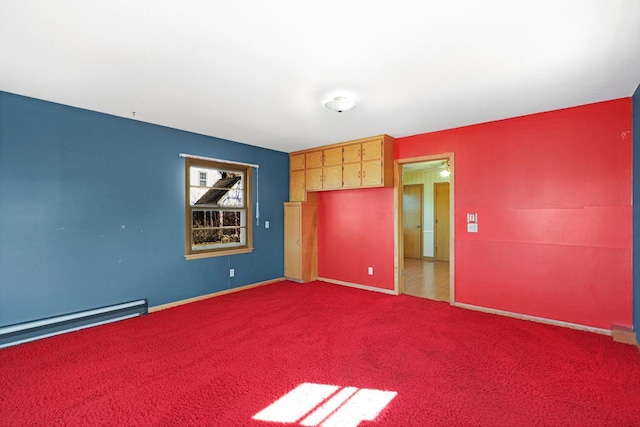 unfurnished bedroom with baseboards, carpet floors, and a baseboard radiator