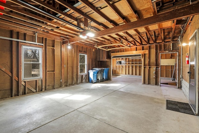 interior space featuring a garage and concrete flooring