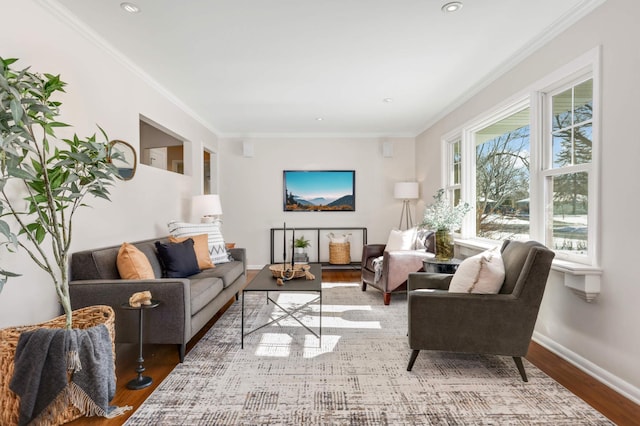 living area featuring ornamental molding, recessed lighting, wood finished floors, and baseboards