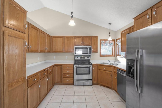 kitchen featuring light tile patterned floors, brown cabinetry, stainless steel appliances, light countertops, and pendant lighting