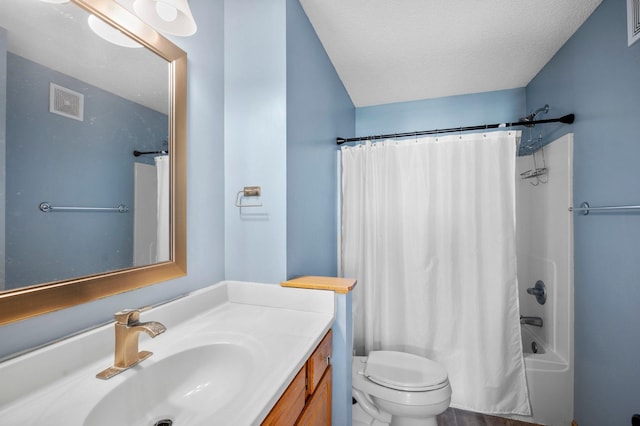 full bathroom with toilet, a textured ceiling, shower / tub combo with curtain, and vanity