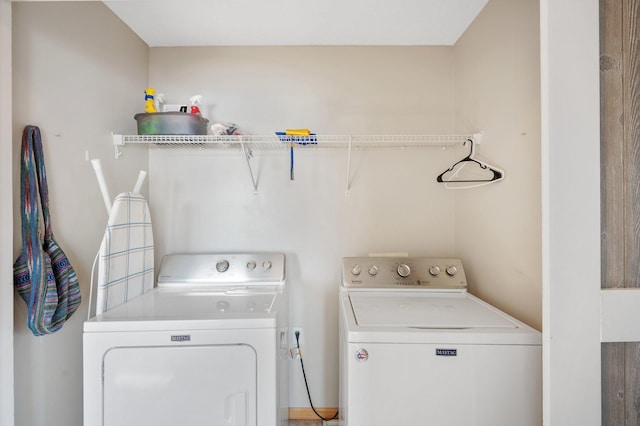 laundry area with independent washer and dryer