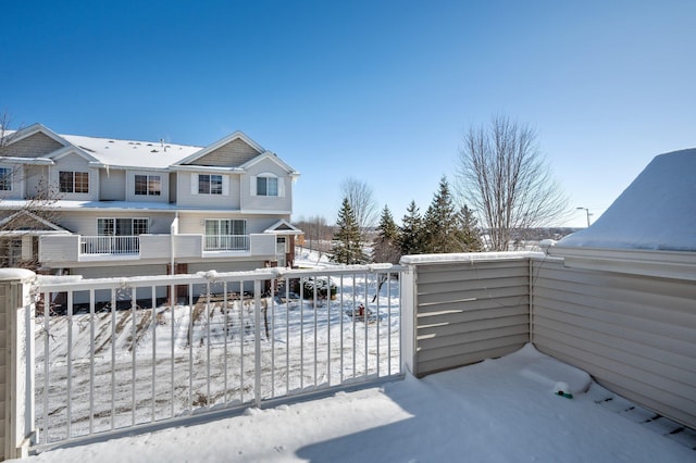 view of snow covered gate