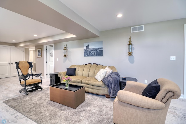 living room featuring visible vents and recessed lighting