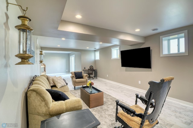 living area with recessed lighting, wood finished floors, and baseboards