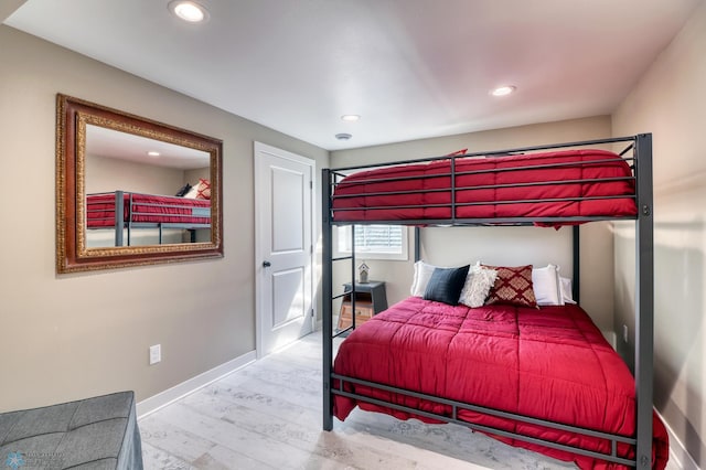 bedroom featuring recessed lighting, baseboards, and wood finished floors