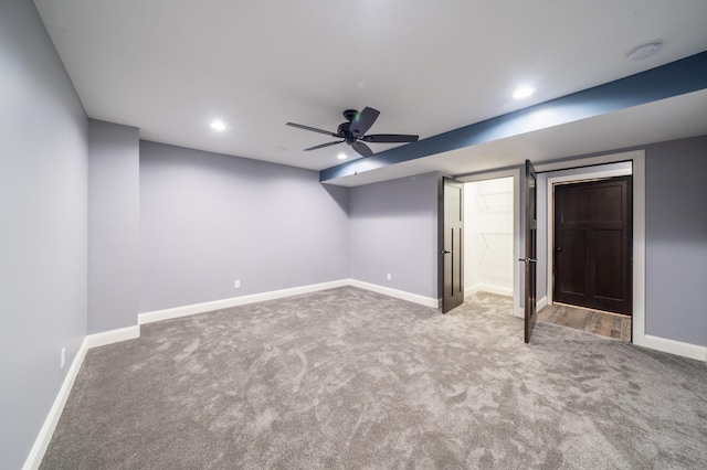 interior space featuring carpet, baseboards, connected bathroom, and recessed lighting