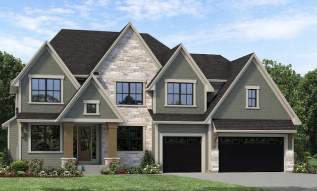 view of front of house with a front lawn and a garage