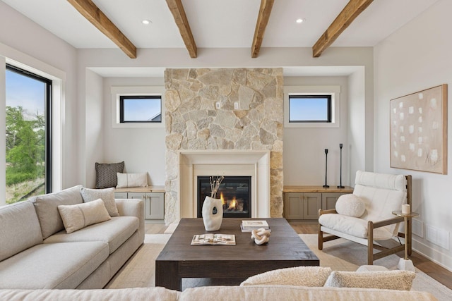 5455 Rolling Hills Pkwy, Victoria, MN 55318 - living room with healthy amount of natural light, light wood-style flooring, a fireplace, and beamed ceiling