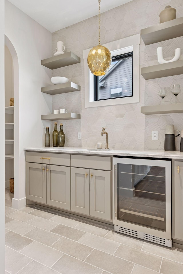 5455 Rolling Hills Pkwy, Victoria, MN 55318 - indoor wet bar with wine cooler, backsplash, decorative light fixtures, and arched walkways
