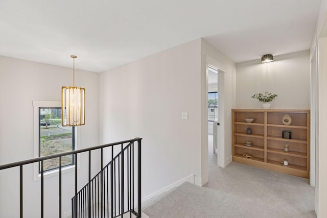 5455 Rolling Hills Pkwy, Victoria, MN 55318 - hallway with an upstairs landing, light carpet, plenty of natural light, and a chandelier