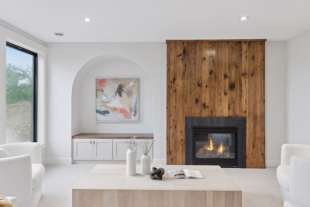 5455 Rolling Hills Pkwy, Victoria, MN 55318 - carpeted living room featuring recessed lighting, a glass covered fireplace, and baseboards