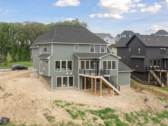 5455 Rolling Hills Pkwy, Victoria, MN 55318 - back of property featuring stairs, a deck, roof with shingles, and a residential view