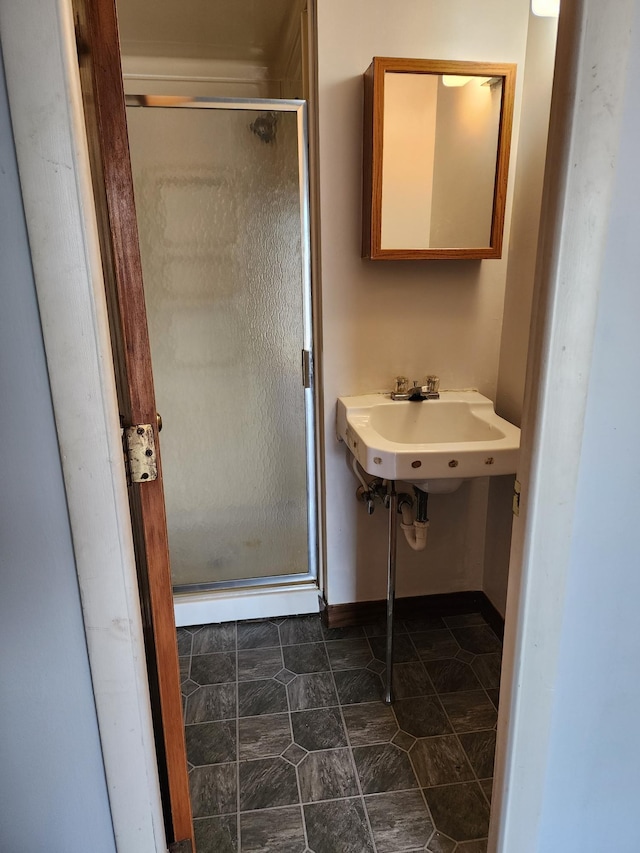 bathroom with sink, tile patterned flooring, and an enclosed shower