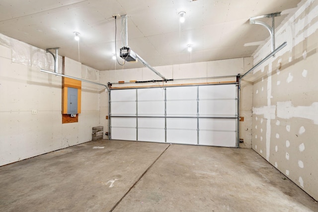 garage with electric panel and a garage door opener