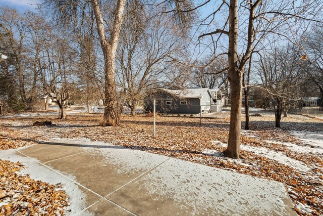 view of yard layered in snow