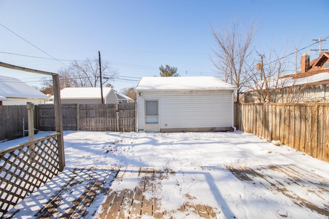 view of snow covered garage