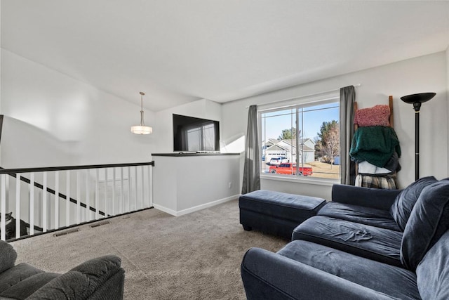 living room featuring vaulted ceiling and carpet flooring