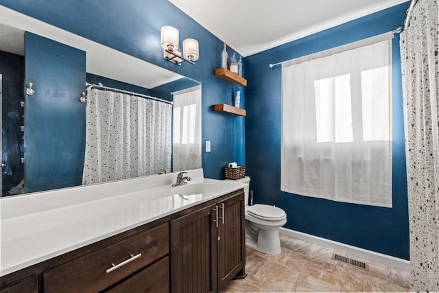 bathroom with toilet and vanity