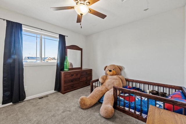 carpeted bedroom featuring ceiling fan