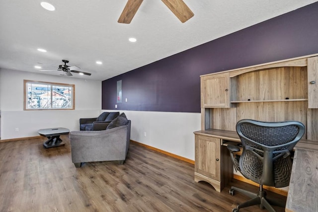 office space featuring ceiling fan and dark hardwood / wood-style flooring