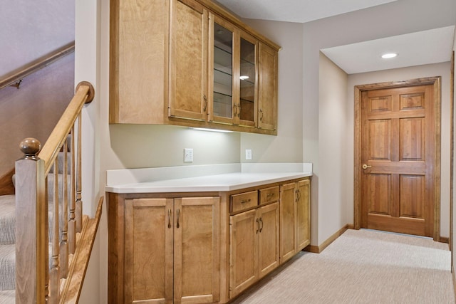 bar featuring baseboards and light colored carpet