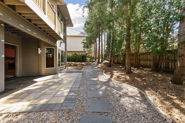 view of patio / terrace featuring fence